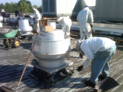 Roofer repairing a membrane